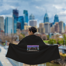 Load image into Gallery viewer, Philagonia Philadelphia Skyline Black Blanket | 62&quot;W x 78&quot;L on a model

